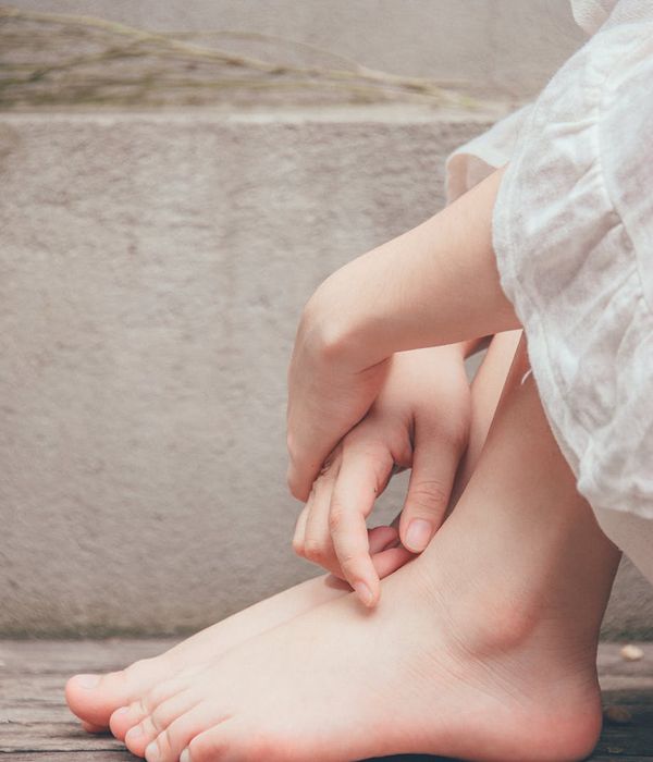 Person finding balance in a serene natural environment with soft lighting.